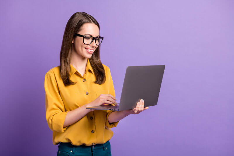 Woman smiling with laptop