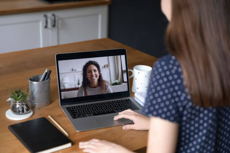 two-women-participate-in-a-remote-meeting